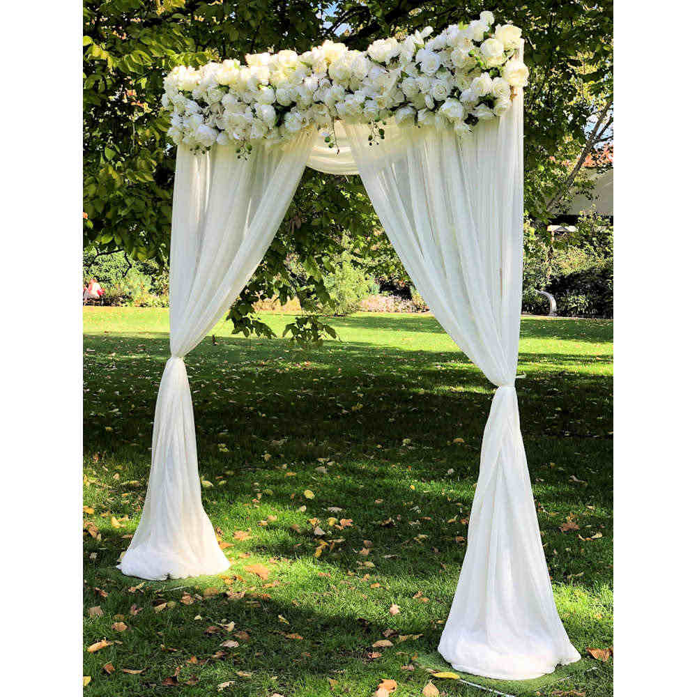 Arch with Curtain Draping - Weddings of Distinction