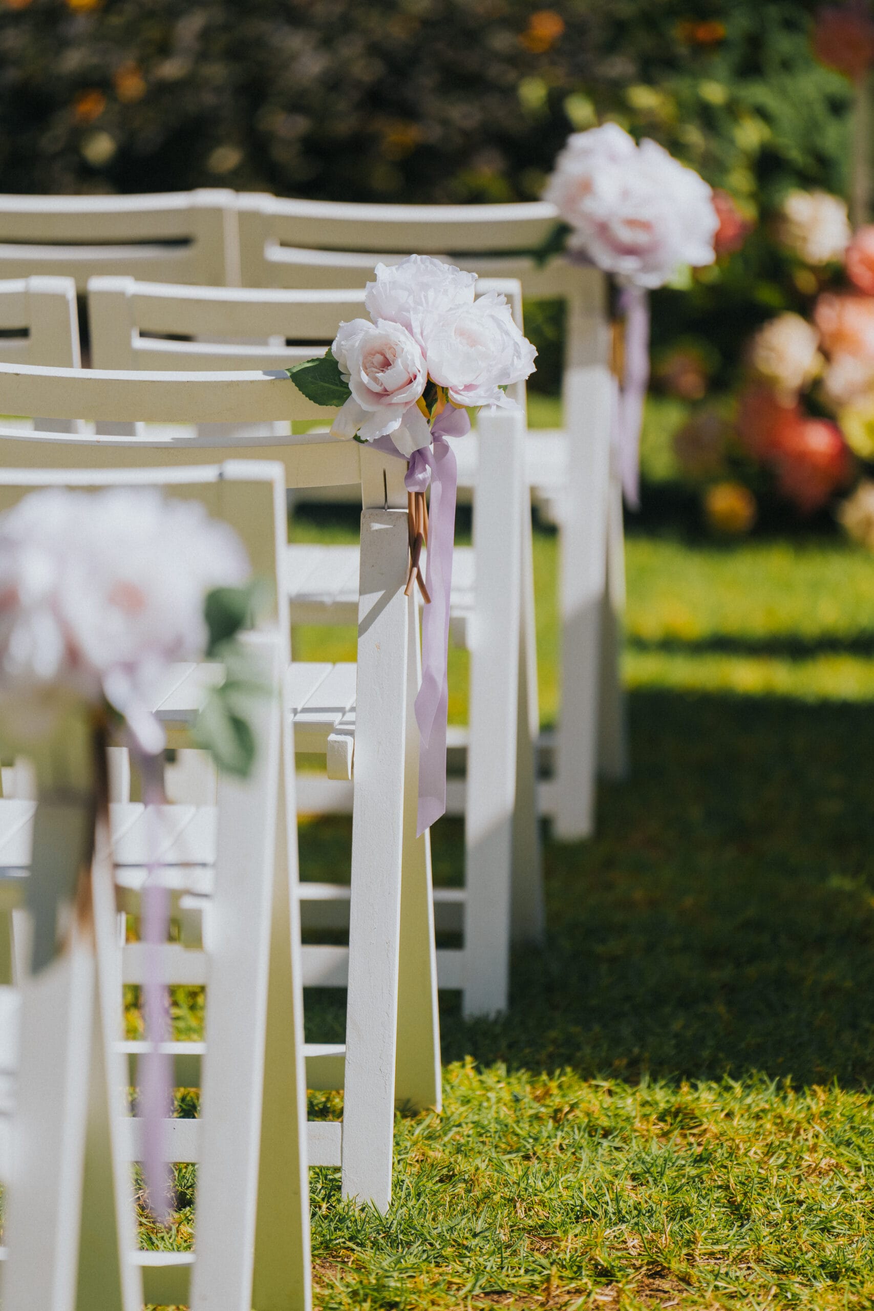 White Wooden Chair and Lilac peony silk floral posy with Lilac Ribbon