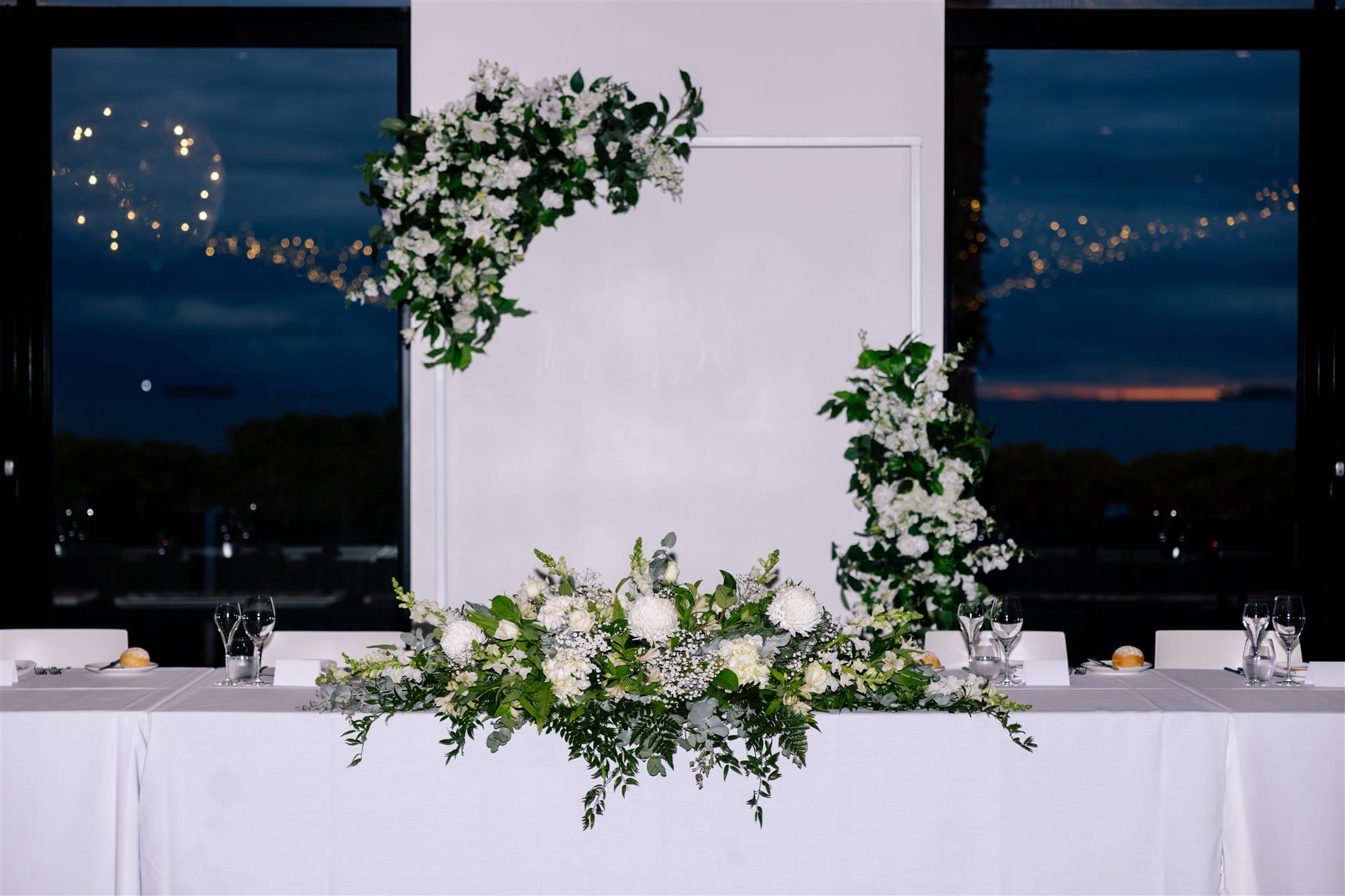 White metal arbour and Spring Garden silk floral arrangement at Encore