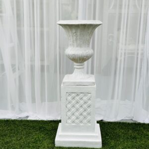 Textured small fluted white urns on textured criss-cross small pedestal