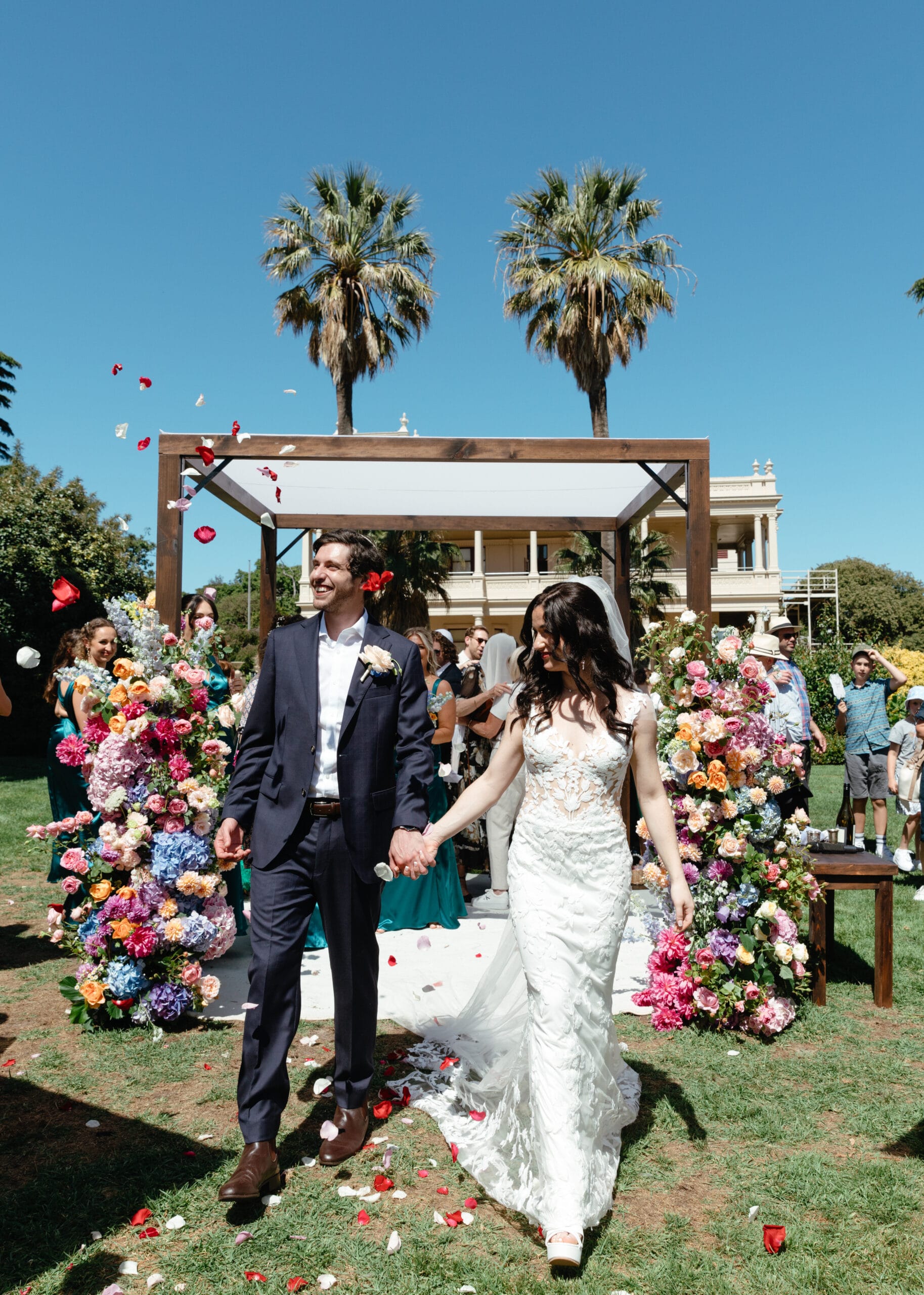 Dark Stain Timber Chuppah with fresh florals