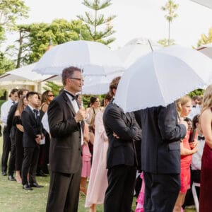 White Frilled Handheld Umbrella at Rippon Lea Estate