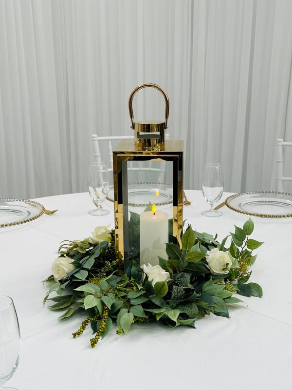 Modern gold lantern with silk wreath centrepiece