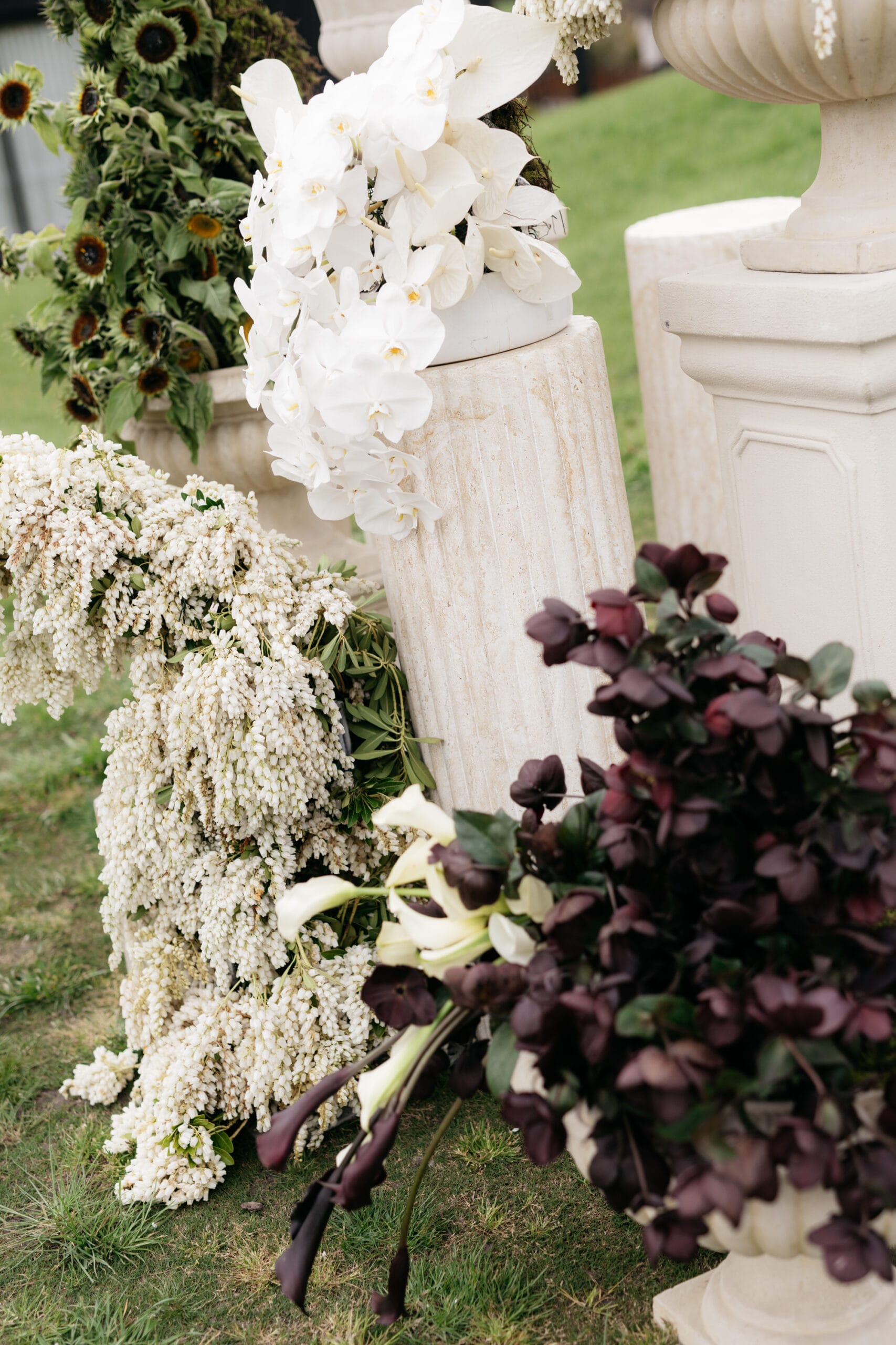 Marble look ripple plinth with assorted sandstone urns and pedestals at Huberts Estate