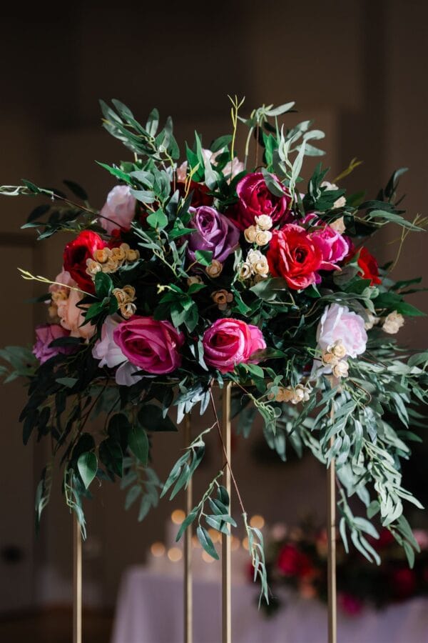 Gold stand with pink, red and beige silk floral arrangement with foliage - Image 4