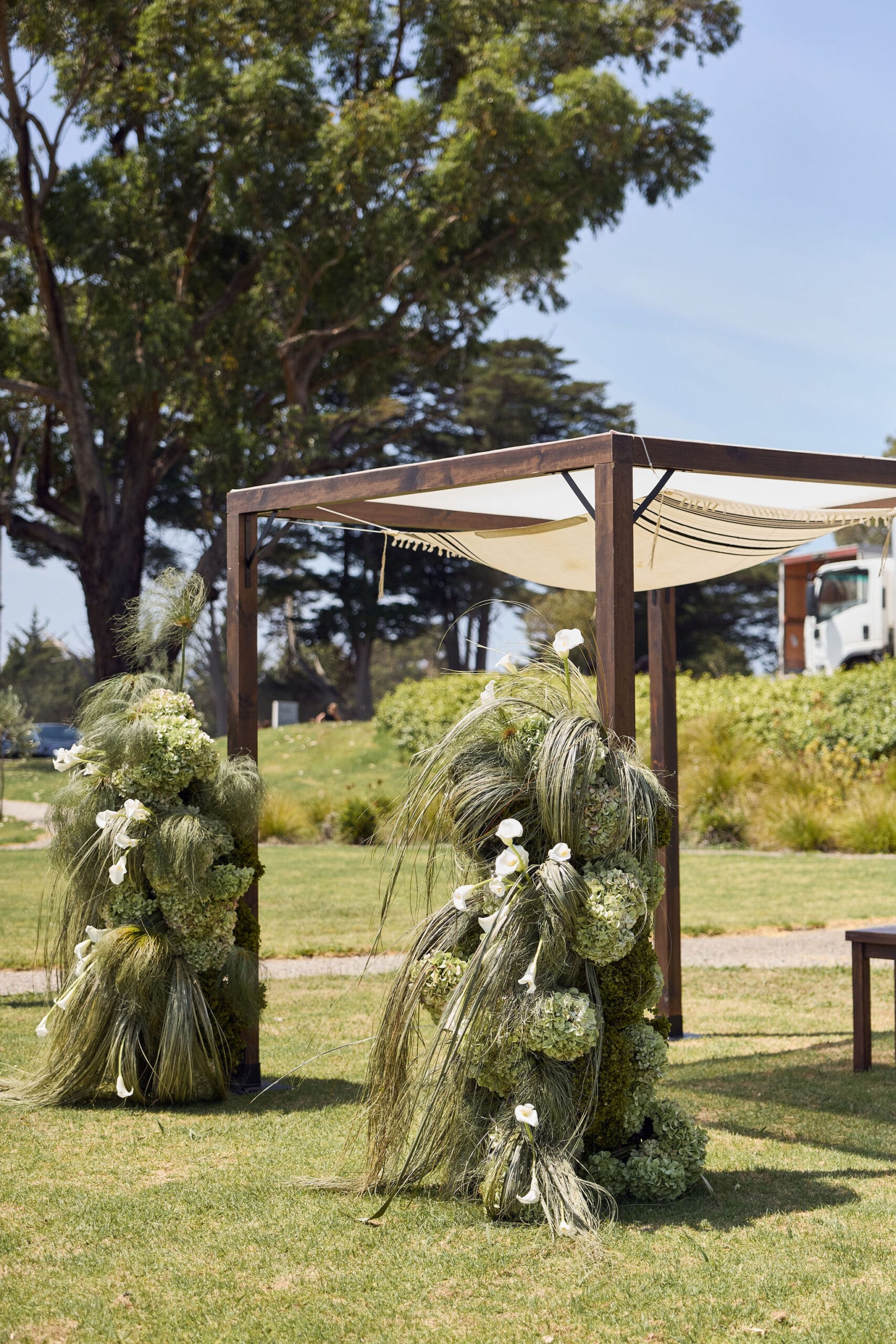Dark Stain Timber Chuppah with fresh florals