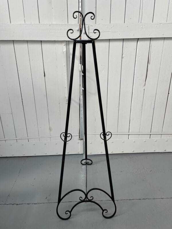 Black easel with swirl detail